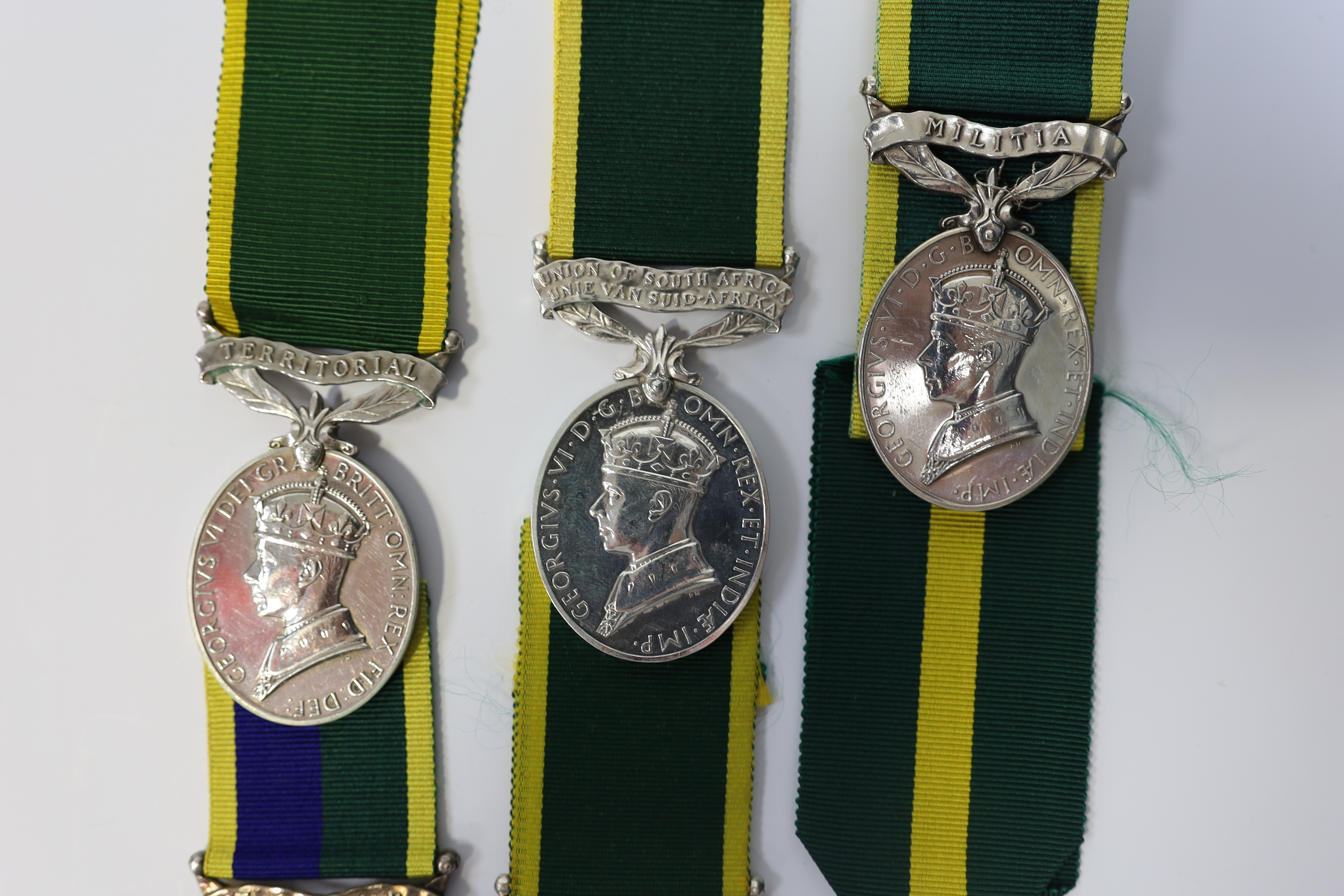 Six assorted Efficiency medals; GV (C) India to Pte.F.S.Slee,1 E.I.RY.R.,A.F.I.;GV (A) Territorial to 477046 Sjt H.W.Pawley, R.A.M.C.; GVI Militia to 2313197 Sclmn.S.H.Dummer, R.Signals.; GVI Territorial to 1434970 Gnr C